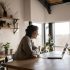 happy woman video chatting on laptop in kitchen